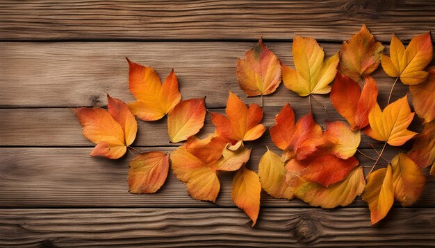 a wooden background with autumn leaves on it