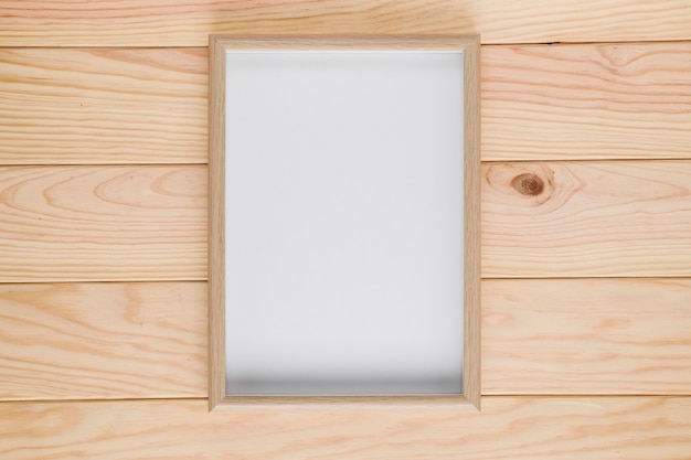 Wooden background with empty frame