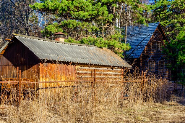 A wooden barn with a metal roof and a metal roof.