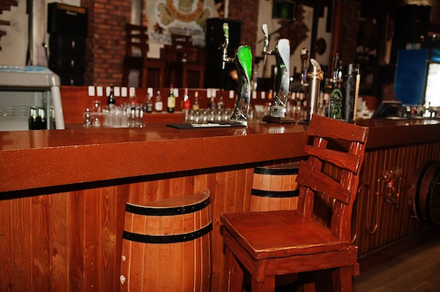 Wooden barrel and chair in pub bar counter.