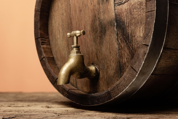 Wooden barrel with tap and worn old table of wood