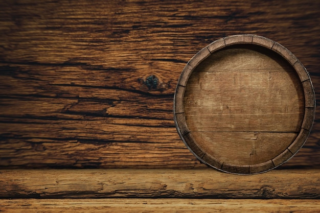 Wooden barrel and worn old table of wood