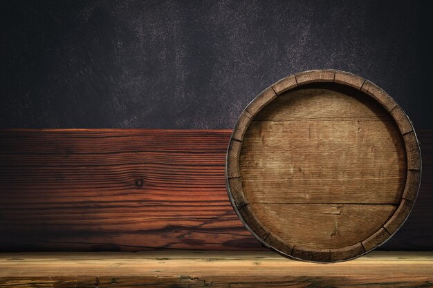 Wooden barrel and worn old table of wood