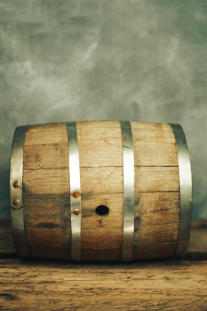 Wooden barrel and worn old table of wood