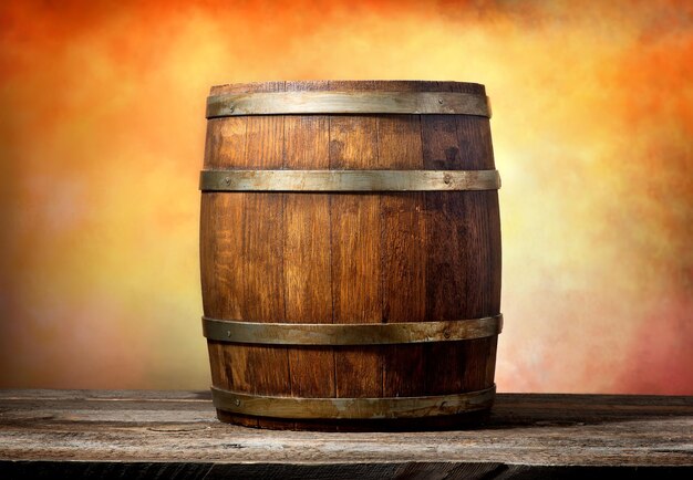 Wooden barrel on a yellow-red background