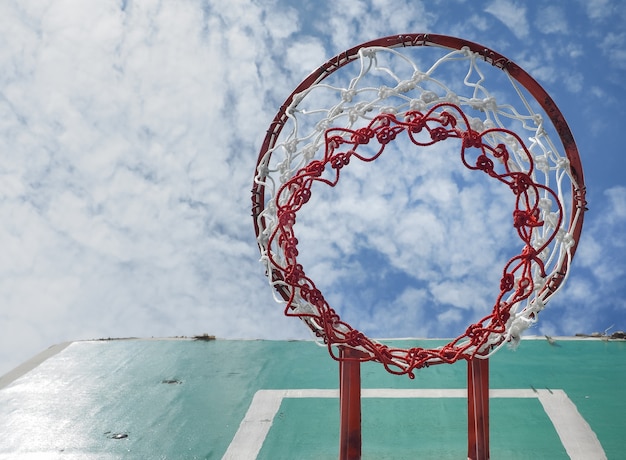 Wooden basket hoop on blue sky.