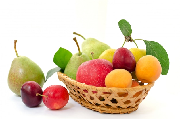 Wooden basket with ripe fruits.