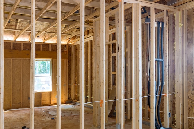 Wooden beams and wall to ceiling framed building under construction interior residential home