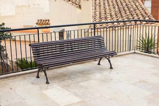 Wooden bench in the city park outdoors