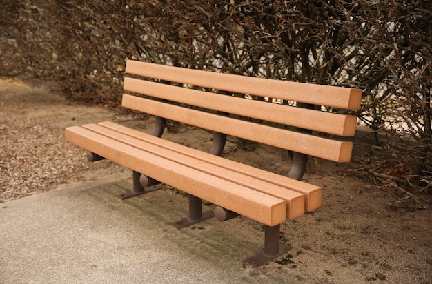 A wooden bench with the word " on it " on the side.