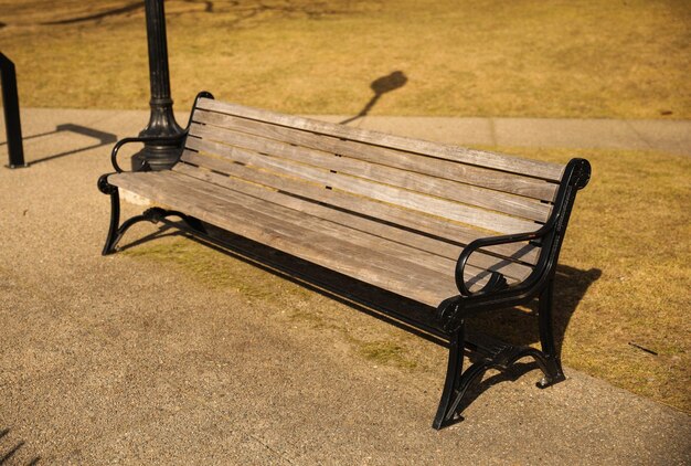 A wooden bench with the word " park " on it