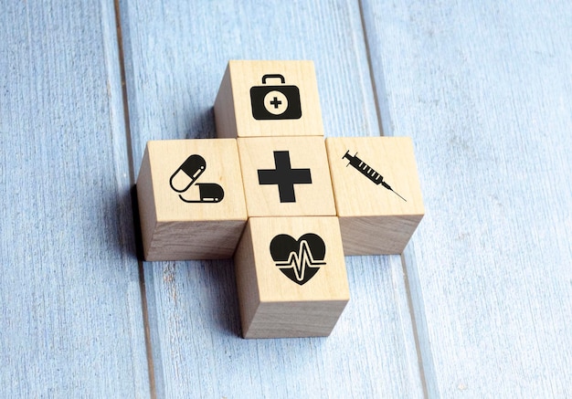 Wooden block arrangement with healthcare medical icons Maintenance