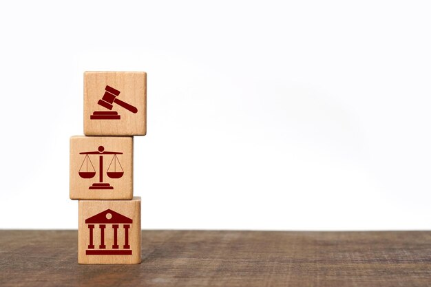 Wooden block cube shape with icon law legal justice on the wooden floor