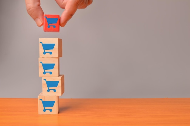 Wooden block cubes with shopping cart icons