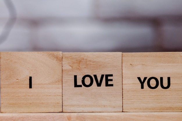 Wooden block with description: I love you on white background, Copy space.