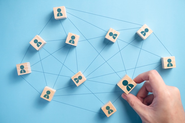 wooden block with people icon teamwork business group. connection networking business concepts.
