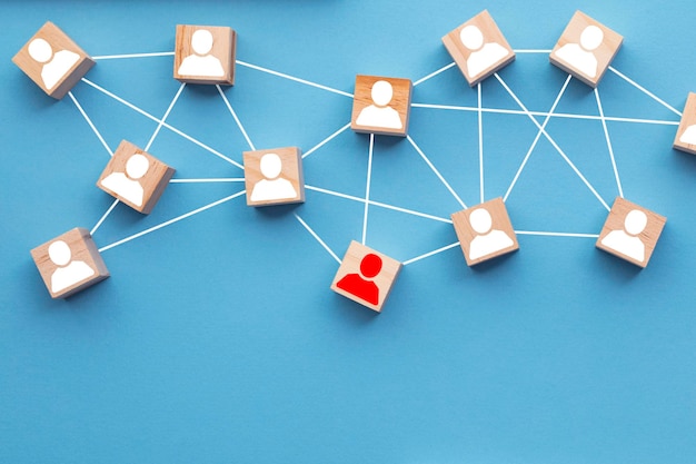 Photo wooden blocks connected together on a blue background teamwork concept