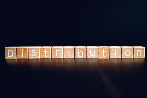 Photo wooden blocks form the text distribution against a black background