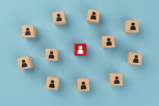 Wooden blocks and one red block in the center of the group with people icon on blue background, 3D rendering. Human resources and team management concept, group leadership.