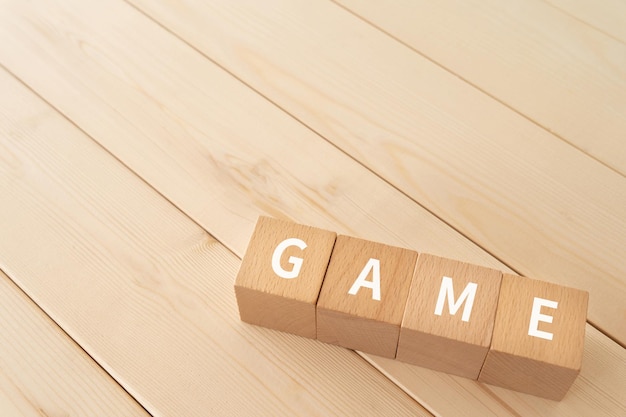 Wooden blocks with GAME text of concept.