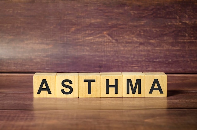 Wooden Blocks with the text Asthma on wooden background