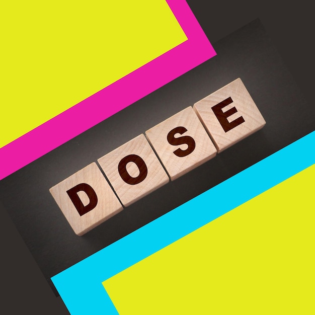 Photo wooden blocks with the word dose medical concept