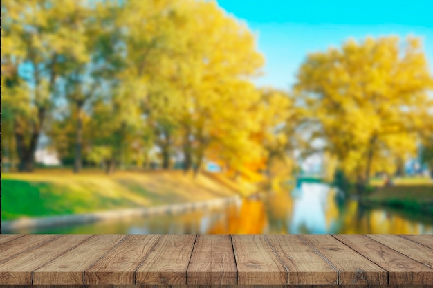 Wooden board empty table blurred autumn background used for display products