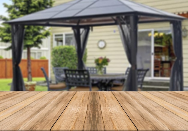 Wooden board empty table blurred background modern summer house gazebo terrace