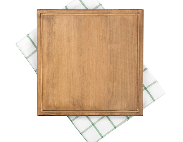 Wooden board and napkin on white background