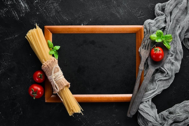 Wooden board for notes with vegetables Menu On the old background Top view Free copy space