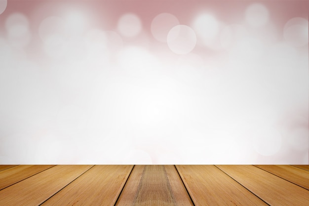 Wooden board with Abstract Blurred pink tone lights background.