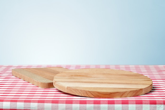 Wooden board with a napkin on a table