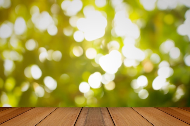 Wooden board with Natural green blurred background. 