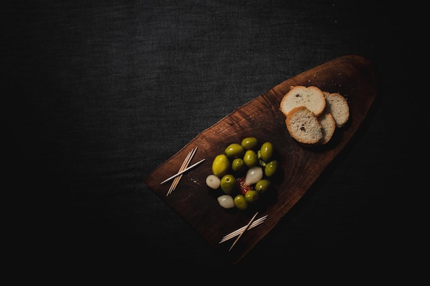 wooden board with olives