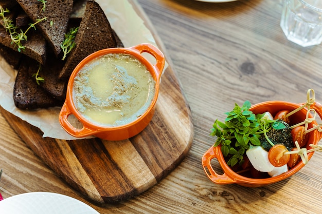 wooden Board with rye crackers with rosemary