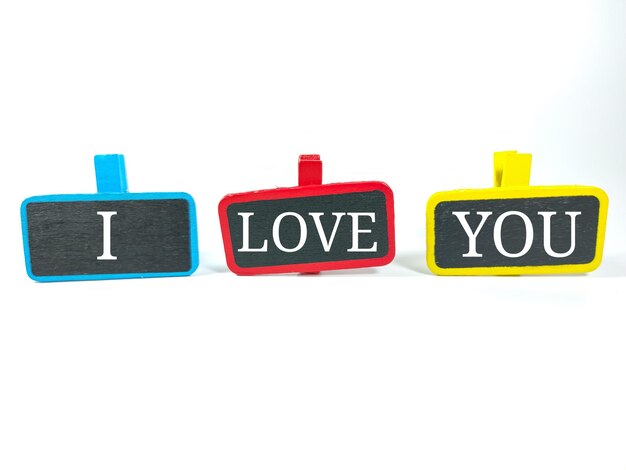 Wooden board with text I LOVE YOU on white backgroundLifestyle concept