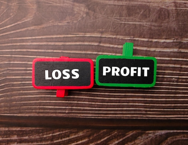 Wooden board with the word LOSS PROFIT
