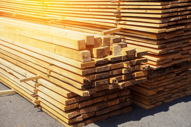 Wooden boards are stacked in a sawmill or carpentry shop Drying and marketing of wood