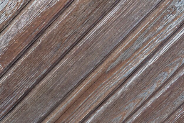 Wooden boards arranged diagonally Wood texture Dark wood color Background with copy space