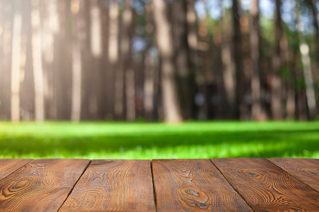 wooden boards closeup against the background of a forest and a green meadow
