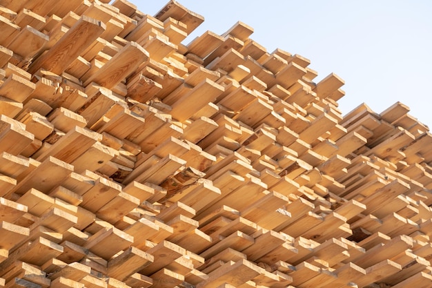 Wooden boards lumber industrial wood timber Pine wood timber stack of natural rough wooden boards on building site Industrial timber building materials