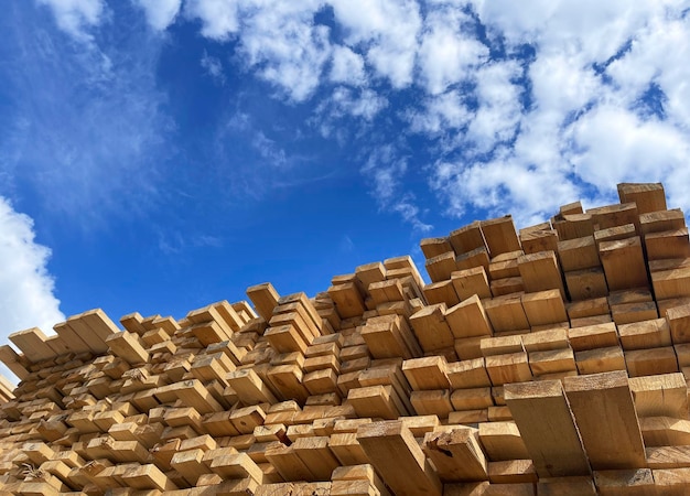 Wooden boards lumber industrial wood timber pine wood timber stack of natural rough wooden boards on building site industrial timber building materials