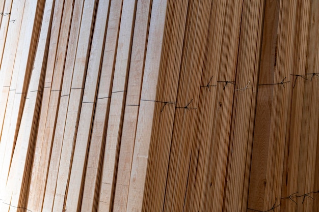 Photo wooden boards stored wood timber construction material for background and texture stack of wooden