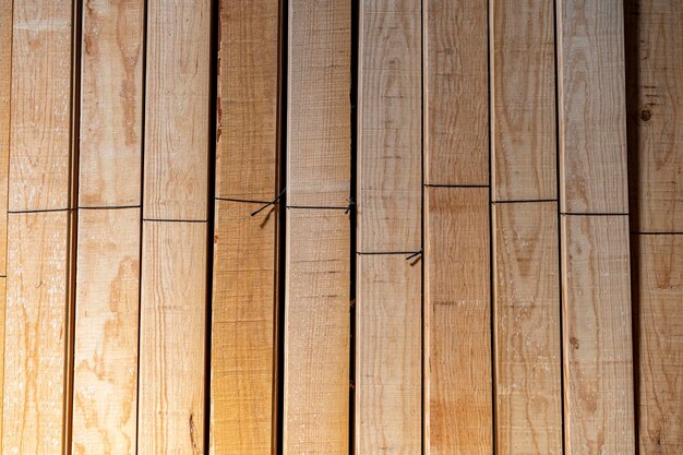 Photo wooden boards stored wood timber construction material for background and texture stack of wooden