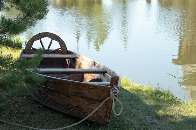 Wooden boat by the lake with copy space