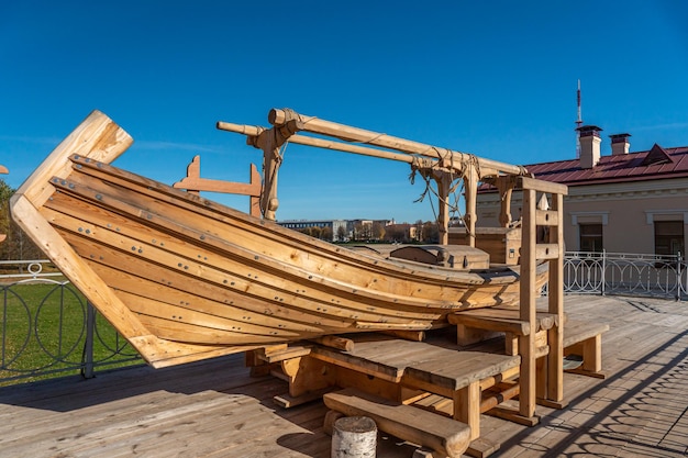 A wooden boat on a deck with the word viking on it