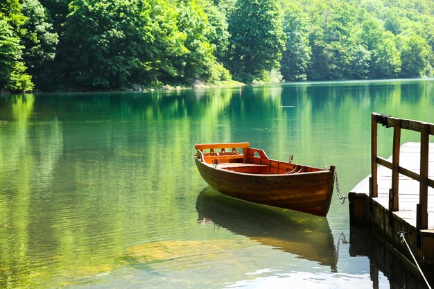 Wooden boat on mountain lake