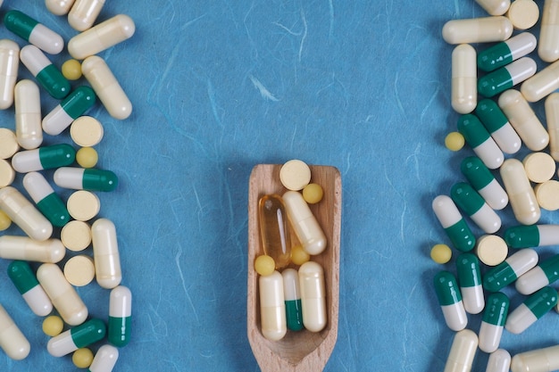 A wooden boat with pills on it