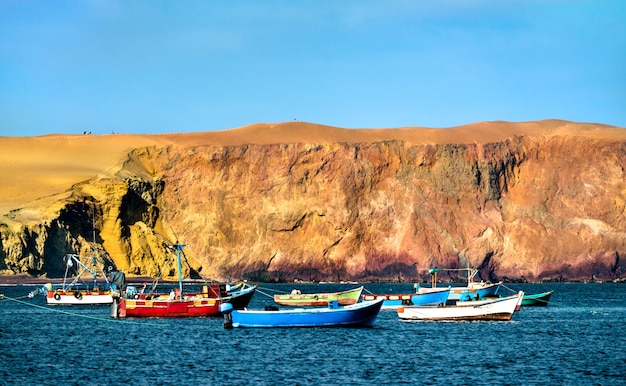 Wooden boats at Paracas National Reserve at the Pacific Ocean in Peru