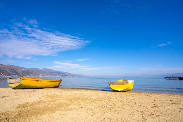 Wooden boats at pier on mountain lake